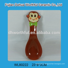 Ceramic spoon rest with monkey figurine
